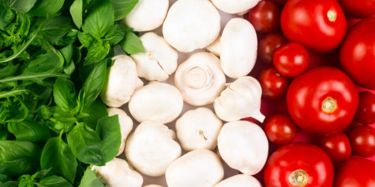 Italian flag from Italian food ingredients: basil, mushrooms, garlic, tomato.