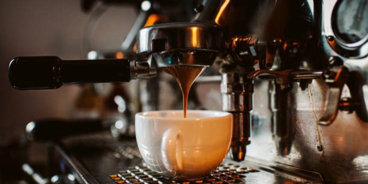 espresso machine pouring coffee into cups